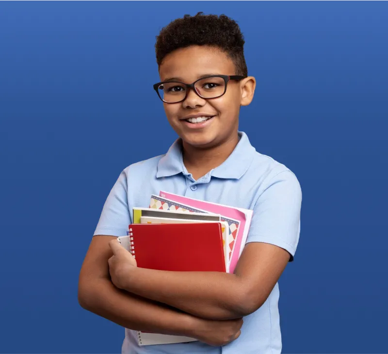 Portrait of Student Holding School Notebooks