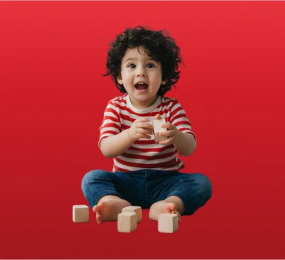 Toddler Playing with Wooden Building Blocks