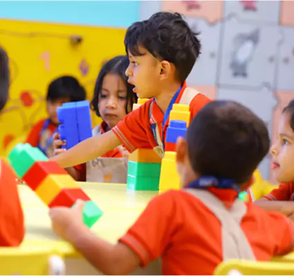 Children Playing with Building Blocks in Kindergarten Classroom