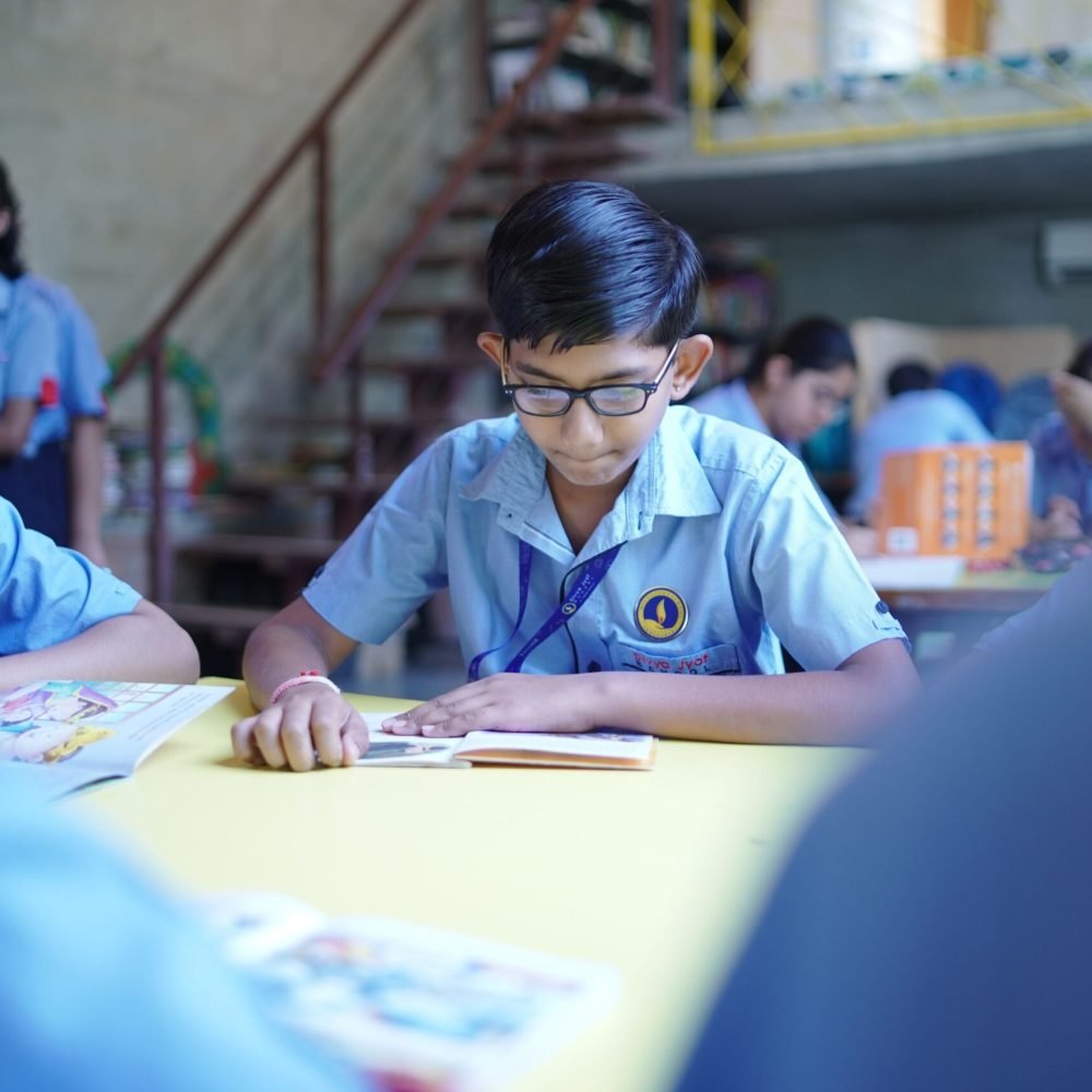 Students Reading Books in School Library