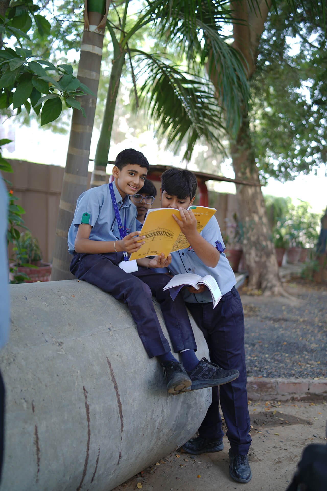Students Reading Together Outdoors