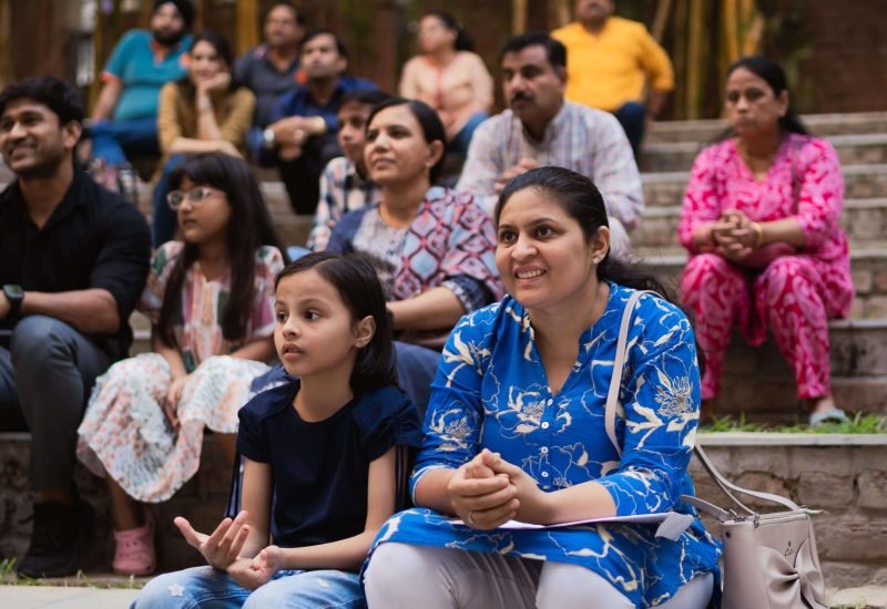 Audience Seated Outdoors Watching a Performance