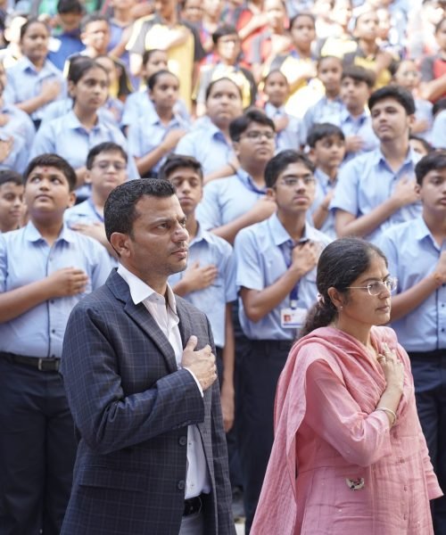 Students and Staff Reciting Pledge at School Assembly