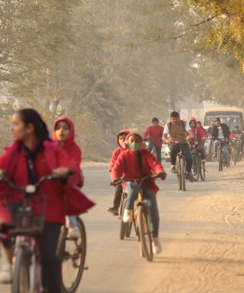 Students and Adults Riding Bicycles